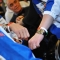 Le atlete indossano il braccialetto per ITALIA 150
