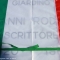 La targa celebrativa coperta dal Tricolore