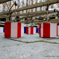 Allestimento del Tappeto volante di Daniel Buren in piazza Palazzo di Città