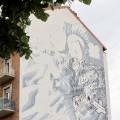 MIllo, il “pittore volante”, torna a Torino per il restyling del gigantesco murale in Barriera di Milano