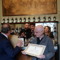 Caffè Elena, L'Assessore Paolo Chiavarino consegna una pergamena per i 135 anni di attività