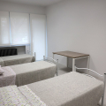 Una delle stanze dell'housing sociale di via Fiesole