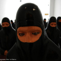 Young girls watching an indian movie, 2004 - Sarenico, Italia